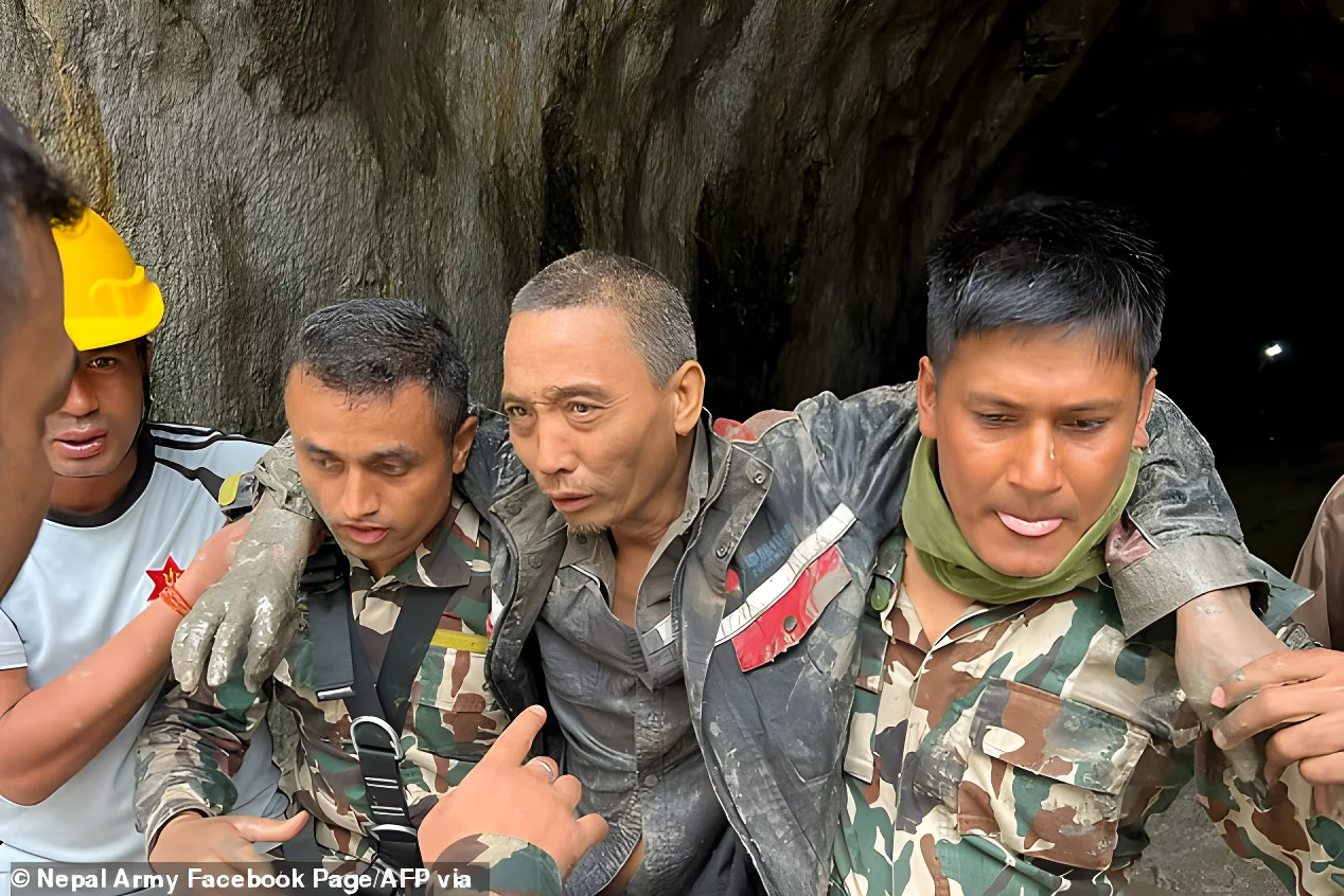 Pictures show rescuers carrying a Chinese national (centre) found in the Upper Trishuli-1 Hydropower Project