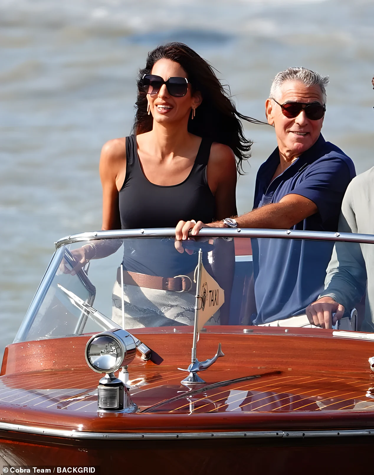 The couple looked the epitome of style as they headed out of Venice on their water taxi